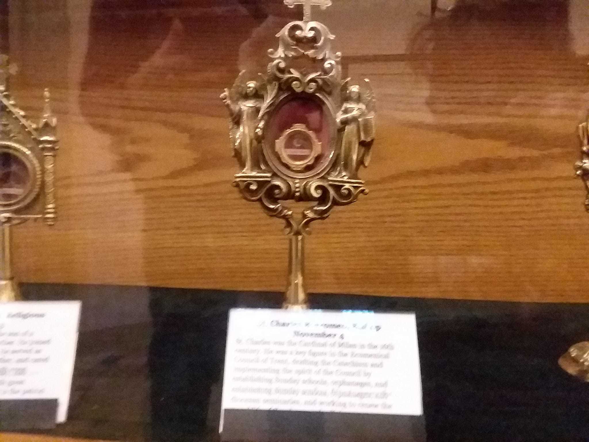 A stand that looks a bit like an award plaque with a tiny vestibule containing the supposed remains of Saint Charles Borromeo